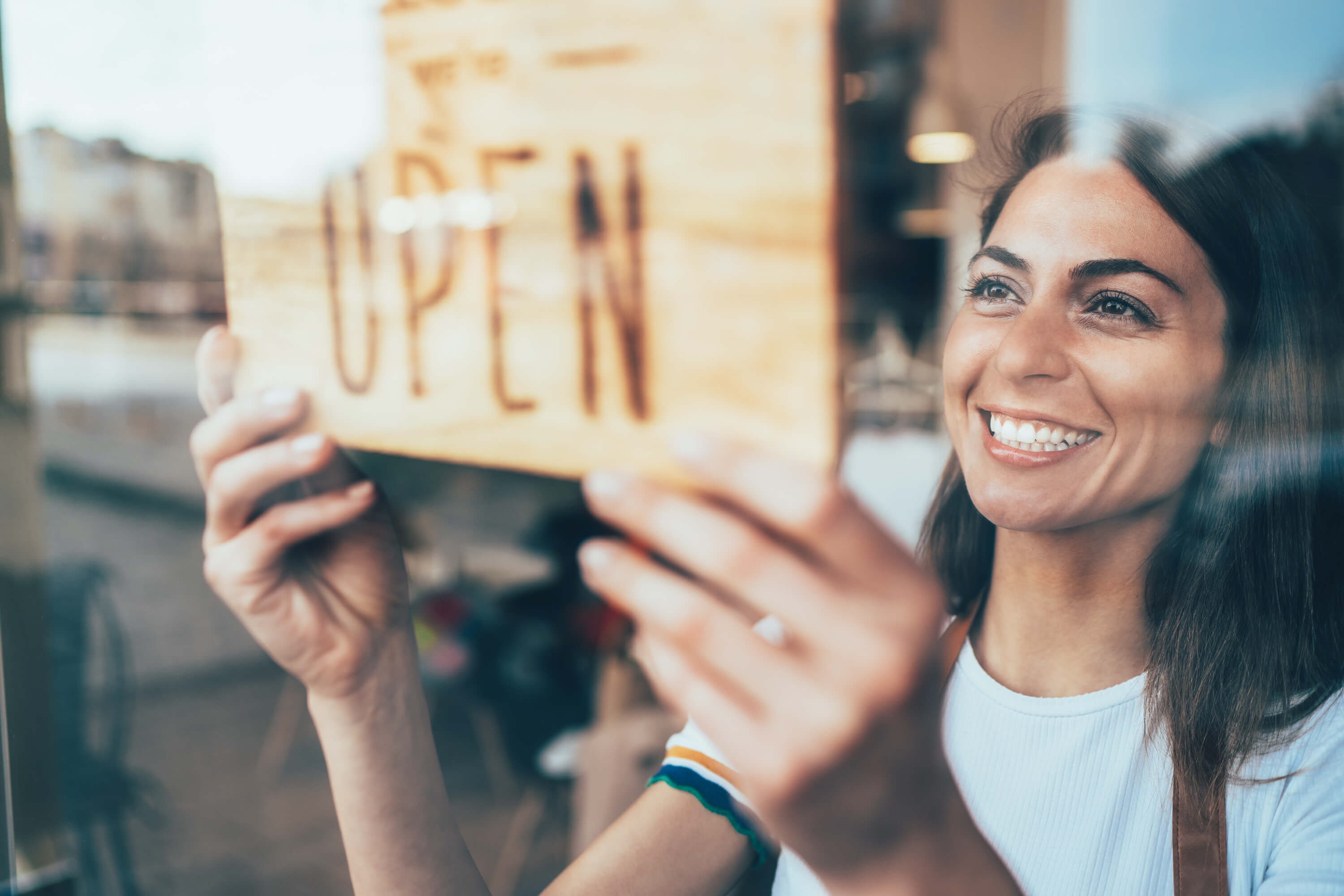 woman smiling after opening her business